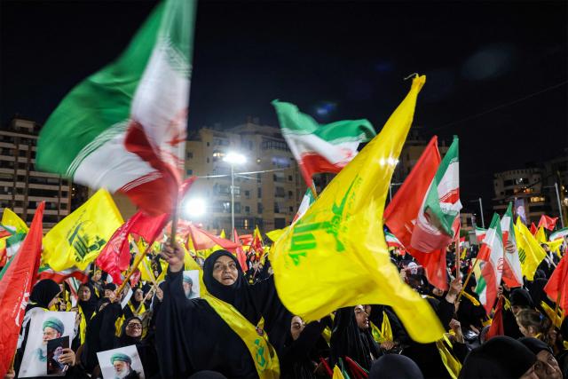 CORRECTION / Supporters of Lebanese Shia movement Hezbollah attend a memorial ceremony mourning Iran's slain supreme leader Ali Khamenei in Beirut’s southern suburbs on July 8, 2026. Iran began six days of public funeral ceremonies for Khamenei on July 4, including a dedicated day to neighbouring Iraq, a Shia powerhouse with close ties to Tehran. (Photo by Anwar AMRO / AFP) / “The erroneous mention[s] appearing in the metadata of this photo by Anwar AMRO has been modified in AFP systems in the following manner: [Correcting dateline and slug]. Please immediately remove the erroneous mention[s] from all your online services and delete it (them) from your servers. If you have been authorized by AFP to distribute it (them) to third parties, please ensure that the same actions are carried out by them. Failure to promptly comply with these instructions will entail liability on your part for any continued or post notification usage. Therefore we thank you very much for all your attention and prompt action. We are sorry for the inconvenience this notification may cause and remain at your disposal for any further information you may require.”