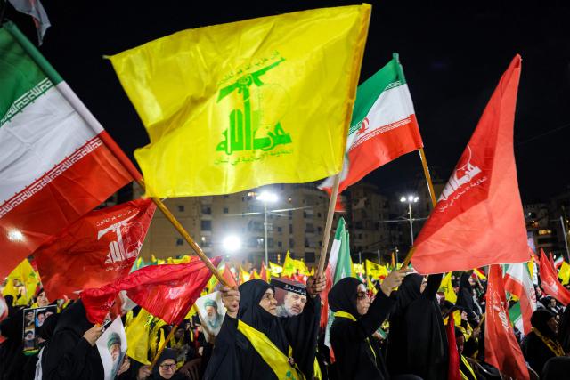 CORRECTION / Supporters of Lebanese Shia movement Hezbollah attend a memorial ceremony mourning Iran's slain supreme leader Ali Khamenei in Beirut’s southern suburbs on July 8, 2026. Iran began six days of public funeral ceremonies for Khamenei on July 4, including a dedicated day to neighbouring Iraq, a Shia powerhouse with close ties to Tehran. (Photo by Anwar AMRO / AFP) / “The erroneous mention[s] appearing in the metadata of this photo by Anwar AMRO has been modified in AFP systems in the following manner: [Correcting dateline and slug]. Please immediately remove the erroneous mention[s] from all your online services and delete it (them) from your servers. If you have been authorized by AFP to distribute it (them) to third parties, please ensure that the same actions are carried out by them. Failure to promptly comply with these instructions will entail liability on your part for any continued or post notification usage. Therefore we thank you very much for all your attention and prompt action. We are sorry for the inconvenience this notification may cause and remain at your disposal for any further information you may require.”