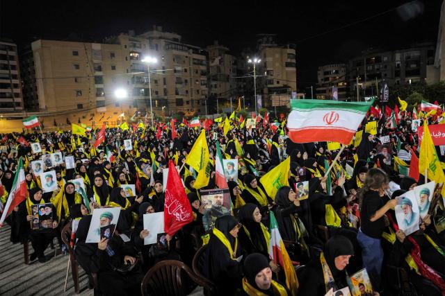 CORRECTION / Supporters of Lebanese Shia movement Hezbollah attend a memorial ceremony mourning Iran's slain supreme leader Ali Khamenei in Beirut’s southern suburbs on July 8, 2026. Iran began six days of public funeral ceremonies for Khamenei on July 4, including a dedicated day to neighbouring Iraq, a Shia powerhouse with close ties to Tehran. (Photo by Anwar AMRO / AFP) / “The erroneous mention[s] appearing in the metadata of this photo by Anwar AMRO has been modified in AFP systems in the following manner: [Correcting dateline and slug]. Please immediately remove the erroneous mention[s] from all your online services and delete it (them) from your servers. If you have been authorized by AFP to distribute it (them) to third parties, please ensure that the same actions are carried out by them. Failure to promptly comply with these instructions will entail liability on your part for any continued or post notification usage. Therefore we thank you very much for all your attention and prompt action. We are sorry for the inconvenience this notification may cause and remain at your disposal for any further information you may require.”