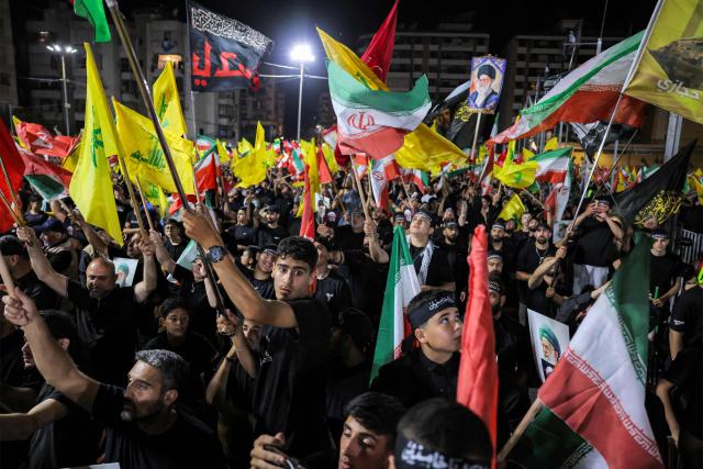 CORRECTION / Supporters of Lebanese Shia movement Hezbollah attend a memorial ceremony mourning Iran's slain supreme leader Ali Khamenei in Beirut’s southern suburbs on July 8, 2026. Iran began six days of public funeral ceremonies for Khamenei on July 4, including a dedicated day to neighbouring Iraq, a Shia powerhouse with close ties to Tehran. (Photo by Anwar AMRO / AFP) / “The erroneous mention[s] appearing in the metadata of this photo by Anwar AMRO has been modified in AFP systems in the following manner: [Correcting dateline and slug]. Please immediately remove the erroneous mention[s] from all your online services and delete it (them) from your servers. If you have been authorized by AFP to distribute it (them) to third parties, please ensure that the same actions are carried out by them. Failure to promptly comply with these instructions will entail liability on your part for any continued or post notification usage. Therefore we thank you very much for all your attention and prompt action. We are sorry for the inconvenience this notification may cause and remain at your disposal for any further information you may require.”