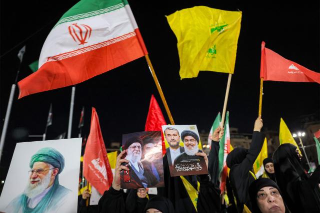CORRECTION / Supporters of Lebanese Shia movement Hezbollah attend a memorial ceremony mourning Iran's slain supreme leader Ali Khamenei in Beirut’s southern suburbs on July 8, 2026. Iran began six days of public funeral ceremonies for Khamenei on July 4, including a dedicated day to neighbouring Iraq, a Shia powerhouse with close ties to Tehran. (Photo by Anwar AMRO / AFP) / “The erroneous mention[s] appearing in the metadata of this photo by Anwar AMRO has been modified in AFP systems in the following manner: [Correcting dateline and slug]. Please immediately remove the erroneous mention[s] from all your online services and delete it (them) from your servers. If you have been authorized by AFP to distribute it (them) to third parties, please ensure that the same actions are carried out by them. Failure to promptly comply with these instructions will entail liability on your part for any continued or post notification usage. Therefore we thank you very much for all your attention and prompt action. We are sorry for the inconvenience this notification may cause and remain at your disposal for any further information you may require.”