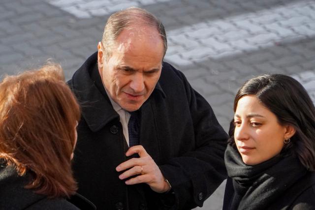 Former Navy commander Claudio Javier Villamide (L), former chief of the Submarine Force Command, arrives alongside his lawyer Magali Crespos for the sentencing hearing in the trial over the 2017 sinking of the ARA San Juan submarine in Rio Gallegos, Santa Cruz province, Argentina, on July 8, 2026. An Argentine court has handed down a three-year suspended prison sentence to former naval commander Claudio Villamide in connection with the sinking of the submarine “ARA San Juan” in 2017, in which all 44 crew members lost their lives, according to the judgement read out by the court on July 8, 2026. (Photo by Walter Diaz / AFP)