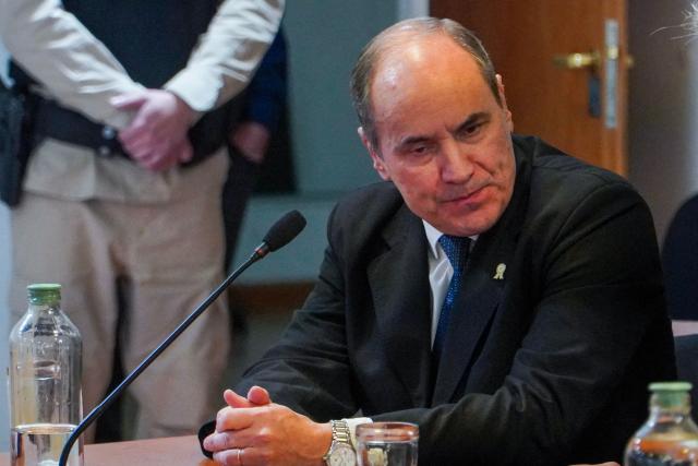 Former Navy commander Claudio Javier Villamide (C), former chief of the Submarine Force Command, attends a sentencing hearing in the trial over the 2017 sinking of the ARA San Juan submarine in Rio Gallegos, Santa Cruz province, Argentina, on July 8, 2026. An Argentine court has handed down a three-year suspended prison sentence to former naval commander Claudio Villamide in connection with the sinking of the submarine “ARA San Juan” in 2017, in which all 44 crew members lost their lives, according to the judgement read out by the court on July 8, 2026. (Photo by Walter Diaz / AFP)