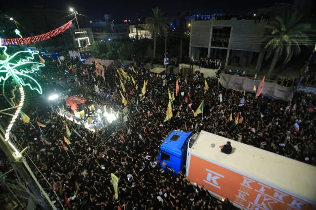 People join a funeral procession for Iran's slain leader Ali Khamenei and members of his family in Karbala early on July 9, 2026. Iranians were preparing on July 9 to bury their slain leader Ali Khamenei in his hometown of Mashhad in northeast Iran, following a multi-day funeral ceremony that attracted millions across various cities in two countries. Following a marathon procession through the holy cities of Najaf and Karbala in neighbouring Iraq, Khamenei would reach his final place of rest in the holy city of Mashhad. (Photo by Murtadha RIDHA / AFP)