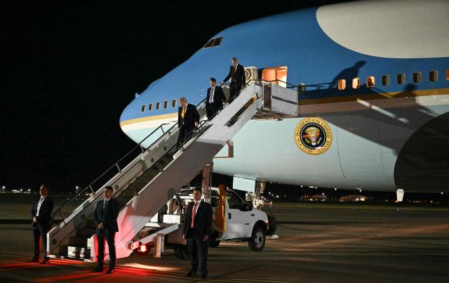 US President Donald Trump disembarks from Air Force One upon arrival at Royal Air Force (RAF) Mildenhall in Mildenhall, eastern England, on July 8, 2026, before transferring to another presidential aircraft for the onward flight to the United States. Trump returns from NATO Summit in Turkey (Photo by SAUL LOEB / AFP)