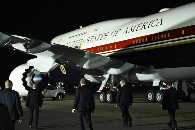 US President Donald Trump walks towards Air Force One after disembarking from the older VC-25A Air Force One at Royal Air Force (RAF) Mildenhall in Mildenhall, eastern England, on July 8, 2026, before continuing his journey to the United States. Trump returns from NATO Summit in Turkey (Photo by SAUL LOEB / AFP)