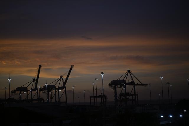 A view of the port of La Guaira, Venezuela, at sunset on July 8, 2026. Venezuela's government called on July 8, 2026 for the release of frozen assets to help raise funds for the country's recovery from last month's twin earthquakes that killed at least 3,600 people. (Photo by Federico PARRA / AFP)