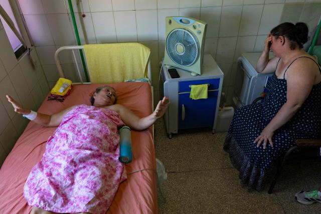 A cancer patient waits as an in-patient at the Institute of Oncology and Radiobiology to undergo a tomography scan in Havana on July 1, 2026. In the midst of one of the worst economic crises Cuba has experienced in decades, the health system is striving to maintain its services and priority programmes despite medicine and supply shortages, technological deterioration, staff shortages, prolonged power cuts and the impact of the United States sanctions. (Photo by YAMIL LAGE / AFP)