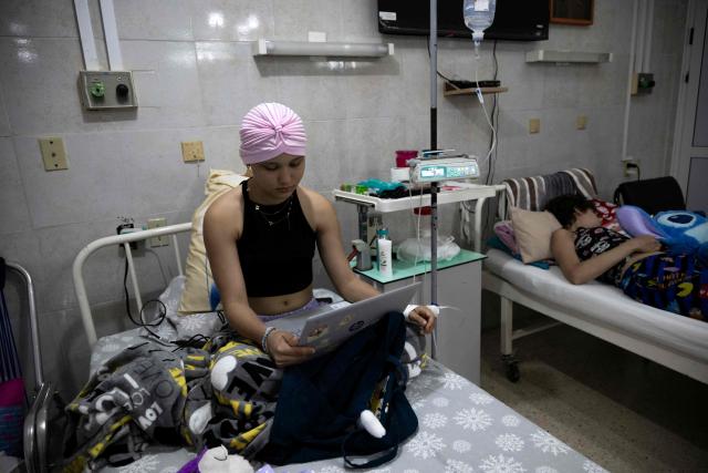 Cuban cancer patients remain hospitalised in a room at the Institute of Oncology and Radiobiology in Havana on July 2, 2026. In the midst of one of the worst economic crises Cuba has experienced in decades, the health system is striving to maintain its services and priority programmes despite medicine and supply shortages, technological deterioration, staff shortages, prolonged power cuts and the impact of the United States sanctions. (Photo by YAMIL LAGE / AFP)