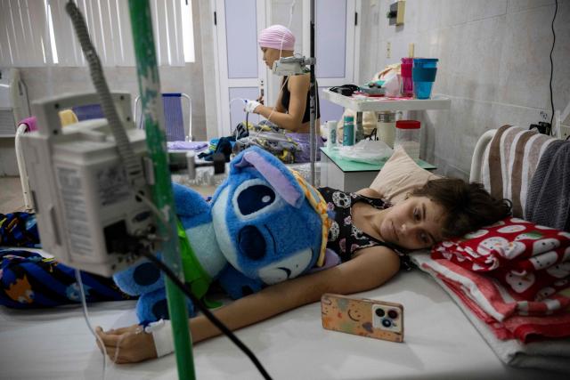Cuban cancer patients remain hospitalised in a room at the Institute of Oncology and Radiobiology in Havana on July 2, 2026. In the midst of one of the worst economic crises Cuba has experienced in decades, the health system is striving to maintain its services and priority programmes despite medicine and supply shortages, technological deterioration, staff shortages, prolonged power cuts and the impact of the United States sanctions. (Photo by YAMIL LAGE / AFP)