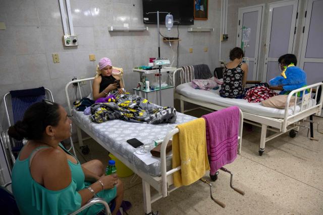 Cuban cancer patients remain hospitalised in a room at the Institute of Oncology and Radiobiology in Havana on July 2, 2026. In the midst of one of the worst economic crises Cuba has experienced in decades, the health system is striving to maintain its services and priority programmes despite medicine and supply shortages, technological deterioration, staff shortages, prolonged power cuts and the impact of the United States sanctions. (Photo by YAMIL LAGE / AFP)