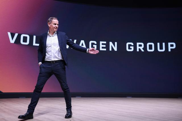 (FILES) German carmaker Volkswagen (VW) CEO Oliver Blume leaves the podium after an annual news conference to present the company's results at the company's headquarters in Wolfsburg, central Germany, on March 11, 2025. German auto giant Volkswagen's management meet on July 9, 2026 to thrash out plans for what could be the biggest ever restructuring in the global auto industry with unions set to protest any mass job cuts. (Photo by Ronny HARTMANN / AFP)