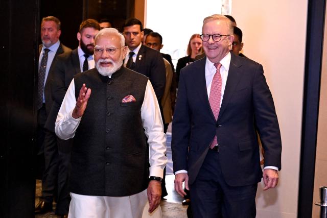 Indian Prime Minister Narendra Modi (L) arrives with Australia’s Prime Minister Anthony Albanese at the Australia-India Economic Roadmap Business Reception in Melbourne on July 9, 2026. (Photo by WILLIAM WEST / AFP)