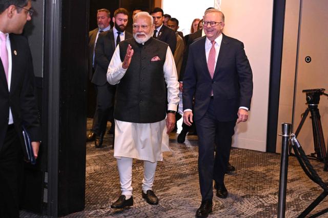 Indian Prime Minister Narendra Modi (L) arrives with Australia’s Prime Minister Anthony Albanese at the Australia-India Economic Roadmap Business Reception in Melbourne on July 9, 2026. (Photo by WILLIAM WEST / AFP)