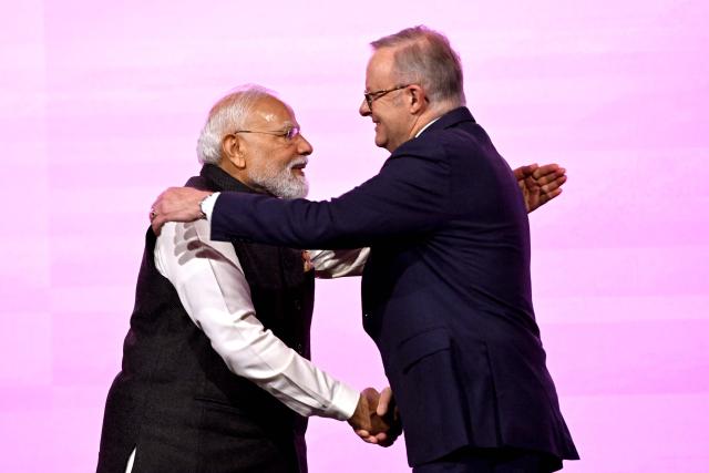 Indian Prime Minister Narendra Modi (L) and Australia’s Prime Minister Anthony Albanese shake hands at the Australia-India Economic Roadmap Business Reception in Melbourne on July 9, 2026. (Photo by WILLIAM WEST / AFP)