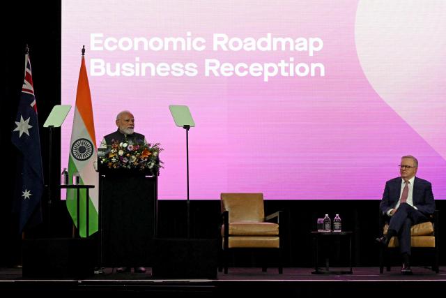 Indian Prime Minister Narendra Modi (L) speaks as Australia’s Prime Minister Anthony Albanese (R) listens at the Australia-India Economic Roadmap Business Reception in Melbourne on July 9, 2026. (Photo by WILLIAM WEST / AFP)