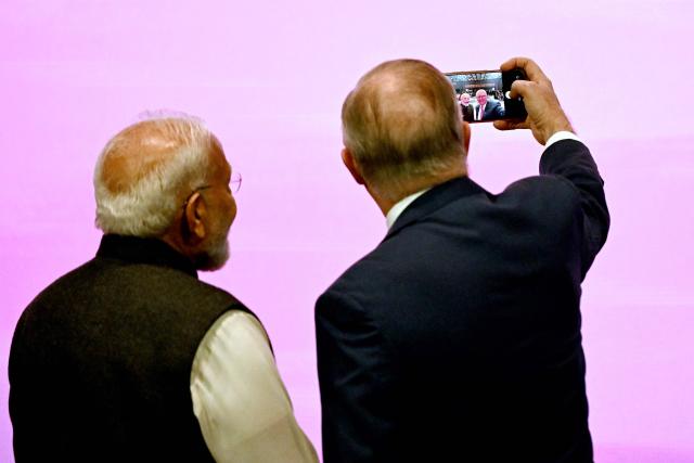 Australia’s Prime Minister Anthony Albanese (R) takes a selfie with Indian Prime Minister Narendra Modi (L) at the Australia-India Economic Roadmap Business Reception in Melbourne on July 9, 2026. (Photo by WILLIAM WEST / AFP)