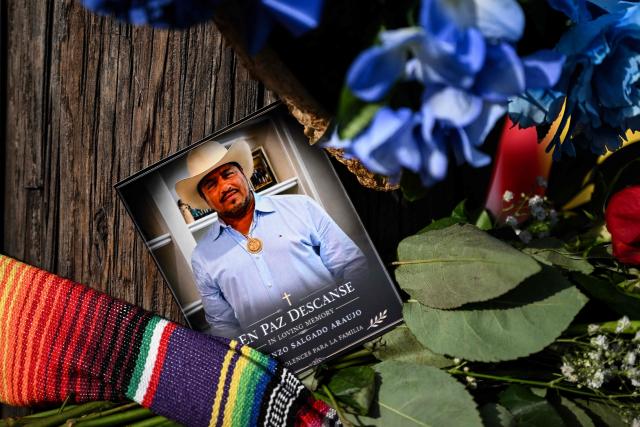 A portrait of Lorenzo Salgado is seen at a memorial where he was killed by an ICE agent, during a protest in Houston, Texas, on July 8, 2026. US Department of Homeland Security (DHS) officials said Tuesday that a federal immigration agent shot and killed a Mexican national during an attempted vehicle stop in Texas. In a statement posted to X, DHS said Immigration and Customs Enforcement (ICE) agents attempted to stop Lorenzo Salgado's vehicle in Houston early Tuesday morning, but the man "attempted to evade arrest." (Photo by RONALDO SCHEMIDT / AFP)
