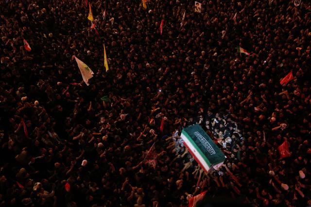 TOPSHOT - Mourners take part in the funeral procession of Iran's late supreme leader Ayatollah Ali Khamenei at Imam Hussein Shrine in Karbala early on July 9, 2026. Iranians were preparing on July 9 to bury their slain leader Ali Khamenei in his hometown of Mashhad in northeast Iran, as new US strikes threatened to trigger a fresh escalation in the Middle East war. The late leader's burial follows a multi-day funeral ceremony that attracted millions of mourners across various cities in both Iran and Iraq. (Photo by Ahmad AL-RUBAYE / AFP)
