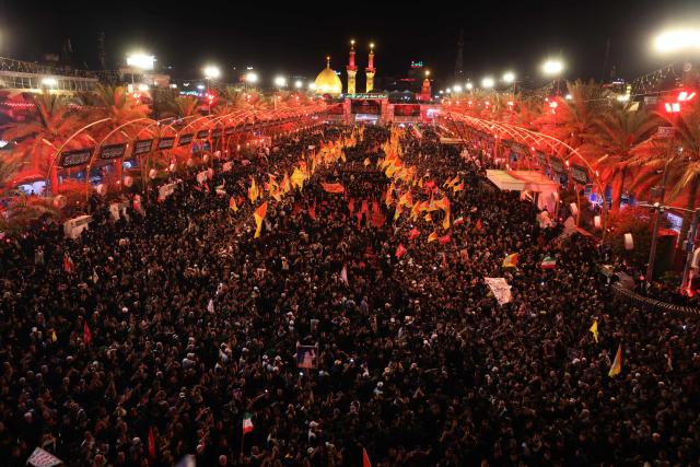 Mourners take part in the funeral procession of Iran's late supreme leader Ayatollah Ali Khamenei at Imam Hussein Shrine in Karbala early on July 9, 2026. Iranians were preparing on July 9 to bury their slain leader Ali Khamenei in his hometown of Mashhad in northeast Iran, as new US strikes threatened to trigger a fresh escalation in the Middle East war. The late leader's burial follows a multi-day funeral ceremony that attracted millions of mourners across various cities in both Iran and Iraq. (Photo by Ahmad AL-RUBAYE / AFP)
