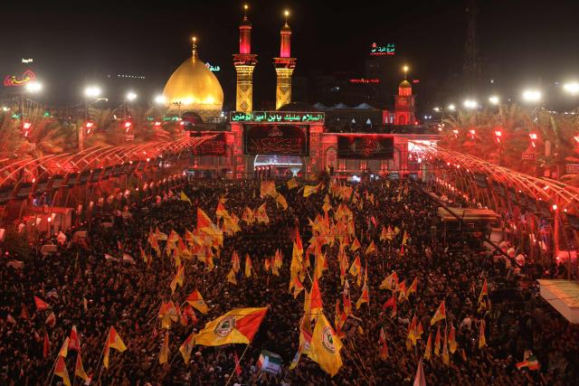 Mourners take part in the funeral procession of Iran's late supreme leader Ayatollah Ali Khamenei at Imam Hussein Shrine in Karbala early on July 9, 2026. Iranians were preparing on July 9 to bury their slain leader Ali Khamenei in his hometown of Mashhad in northeast Iran, as new US strikes threatened to trigger a fresh escalation in the Middle East war. The late leader's burial follows a multi-day funeral ceremony that attracted millions of mourners across various cities in both Iran and Iraq. (Photo by Ahmad AL-RUBAYE / AFP)