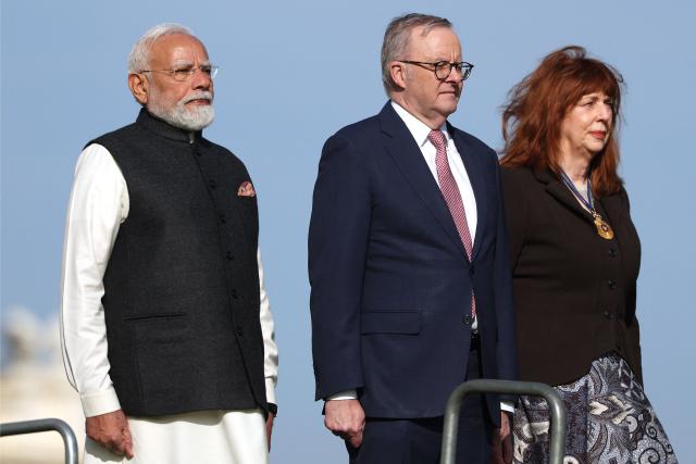 Australia’s Prime Minister Anthony Albanese (C) stands with Indian Prime Minister Narendra Modi (L) and the Governor of Victoria Margaret Gardner (R) during an official welcoming ceremony at Government House Victoria in Melbourne on July 9, 2026. (Photo by MARTIN KEEP / AFP)