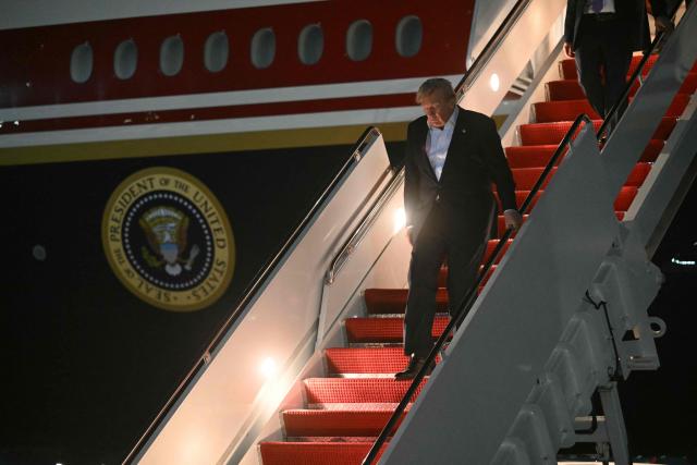 US President Donald Trump disembarks from Air Force One upon arrival at Joint Base Andrews, Maryland on July 9, 2026. Trump is returning from the NATO Summit in Turkey. (Photo by SAUL LOEB / AFP)