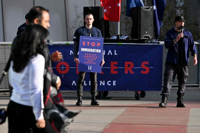 Anti-immigration protesters hold placards and signs outside the venue for a community event with Indian Prime Minister Narendra Modi at Docklands Stadium in Melbourne on July 9, 2026. (Photo by WILLIAM WEST / AFP)