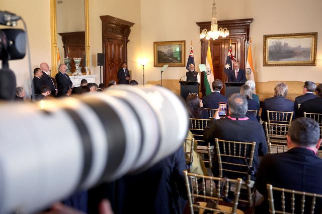 Members of the media can be seen as Australia’s Prime Minister Anthony Albanese (R) talks with Indian Prime Minister Narendra Modi (L) during a press conference at Government House Victoria in Melbourne on July 9, 2026. (Photo by MARTIN KEEP / AFP)