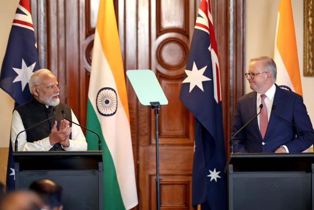 Australia’s Prime Minister Anthony Albanese (R) reacts as he stands with Indian Prime Minister Narendra Modi (L) during a press conference at Government House Victoria in Melbourne on July 9, 2026. (Photo by MARTIN KEEP / AFP)
