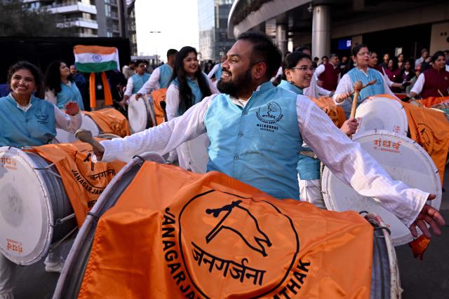 Performers play drums outside the venue for a community event with Indian Prime Minister Narendra Modi at Docklands Stadium in Melbourne on July 9, 2026. (Photo by WILLIAM WEST / AFP)