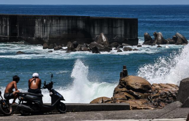 Waves crash against a breakwater as Typhoon Bavi approaches Taiwan, in Keelung on July 9, 2026 (Photo by I-Hwa Cheng / AFP)