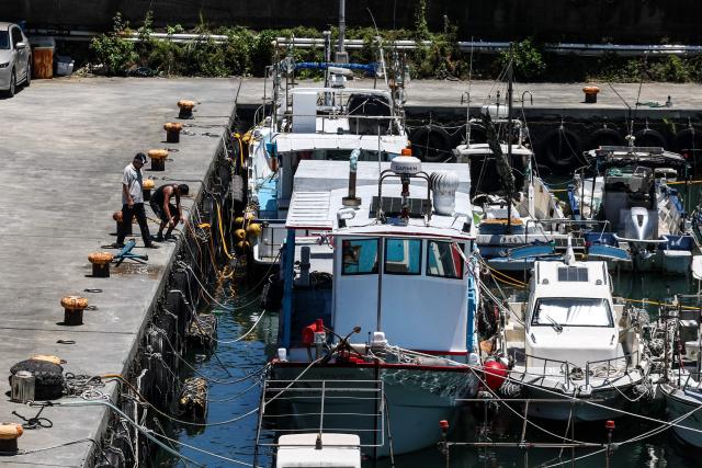 Fishing boats are secured at Shen'ao Harbour ahead of the arrival of Typhoon Bavi, in New Taipei City on July 9, 2026 (Photo by I-Hwa Cheng / AFP)