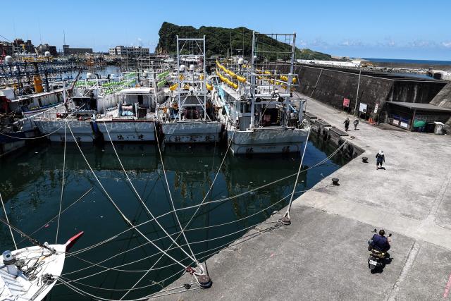 Fishing boats are secured at Shen'ao Harbour ahead of the arrival of Typhoon Bavi, in New Taipei City on July 9, 2026 (Photo by I-Hwa Cheng / AFP)