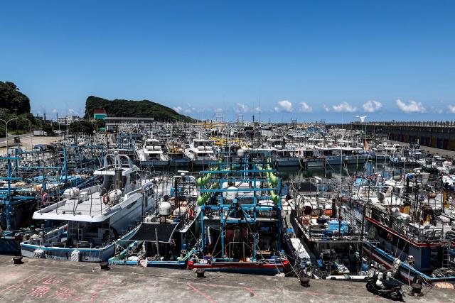 Fishing boats are secured at Shen'ao Harbour ahead of the arrival of Typhoon Bavi, in New Taipei City on July 9, 2026 (Photo by I-Hwa Cheng / AFP)