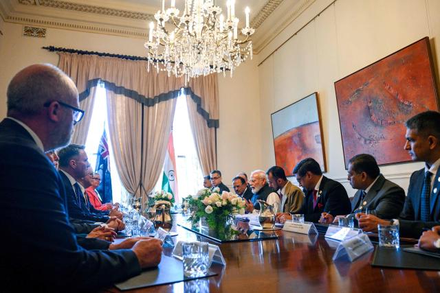 Australia's Prime Minister Anthony Albanese (3rd L) and India's Prime Minister Narendra Modi (5th R) and other officials attend the Australia-India Annual Leaders’ Summit at Government House Victoria on July 09, 2026. (Photo by Izhar KHAN / POOL / AFP)