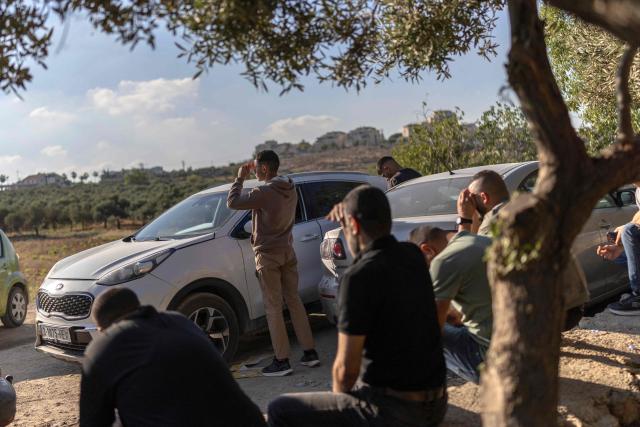 Relatives and family members of Palestinian prisoners, await their release from Israeli prison at the checkpoint on the outskirts of Israeli occupied West Bank city of Ramallah on July 8, 2026. The number of Palestinian detainees in Israeli prisons stands at around 9,500, according to figures released in June by the Palestinian Prisoners Club, the main rights group for Palestinian prisoners. Since the start of the Gaza war in October 2023, violence has escalated in the Israeli-occupied West Bank. (Photo by ilia YEFIMOVICH / AFP)