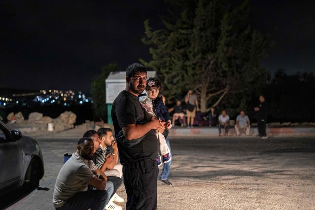Relatives and family members of Palestinian prisoners, await their release from Israeli prison at the checkpoint on the outskirts of Israeli occupied West Bank city of Ramallah on July 8, 2026. The number of Palestinian detainees in Israeli prisons stands at around 9,500, according to figures released in June by the Palestinian Prisoners Club, the main rights group for Palestinian prisoners. Since the start of the Gaza war in October 2023, violence has escalated in the Israeli-occupied West Bank. (Photo by ilia YEFIMOVICH / AFP)