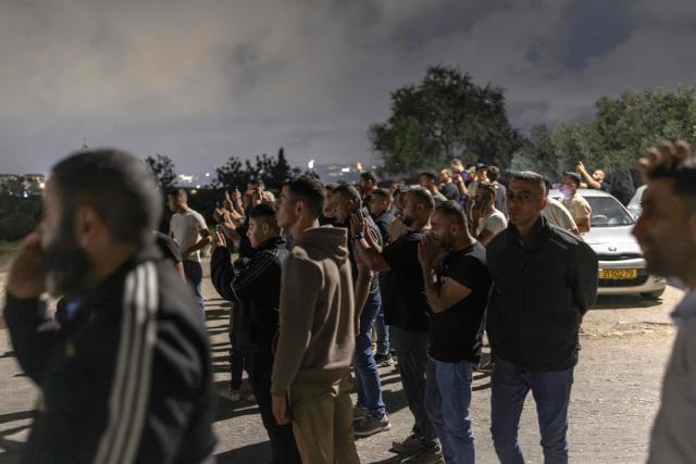 Relatives and family members of Palestinian prisoners, await their release from Israeli prison at the checkpoint on the outskirts of Israeli occupied West Bank city of Ramallah on July 8, 2026. The number of Palestinian detainees in Israeli prisons stands at around 9,500, according to figures released in June by the Palestinian Prisoners Club, the main rights group for Palestinian prisoners. Since the start of the Gaza war in October 2023, violence has escalated in the Israeli-occupied West Bank. (Photo by ilia YEFIMOVICH / AFP)