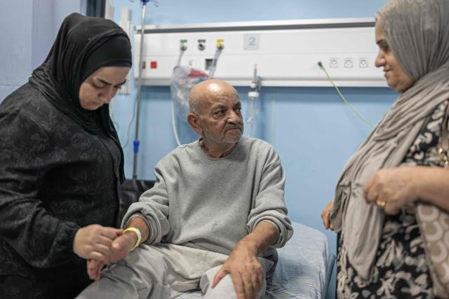 Palestinian journalist Hassan Abdel Jawad is pictured at the hospital following his release from Israeli prison in the Israeli occupied West Bank city of Ramallah on July 8, 2026. The number of Palestinian detainees in Israeli prisons stands at around 9,500, according to figures released in June by the Palestinian Prisoners Club, the main rights group for Palestinian prisoners. Since the start of the Gaza war in October 2023, violence has escalated in the Israeli-occupied West Bank. (Photo by ilia YEFIMOVICH / AFP)