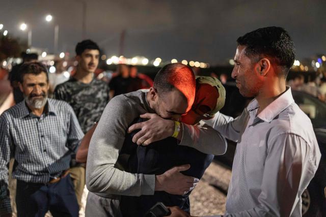 Palestinian Rabia Abu Naim (C) hugs his family member following his release from Israeli prison at the checkpoint on the outskirts of Israeli occupied West Bank city of Ramallah on July 8, 2026. The number of Palestinian detainees in Israeli prisons stands at around 9,500, according to figures released in June by the Palestinian Prisoners Club, the main rights group for Palestinian prisoners. Since the start of the Gaza war in October 2023, violence has escalated in the Israeli-occupied West Bank. (Photo by ilia YEFIMOVICH / AFP)