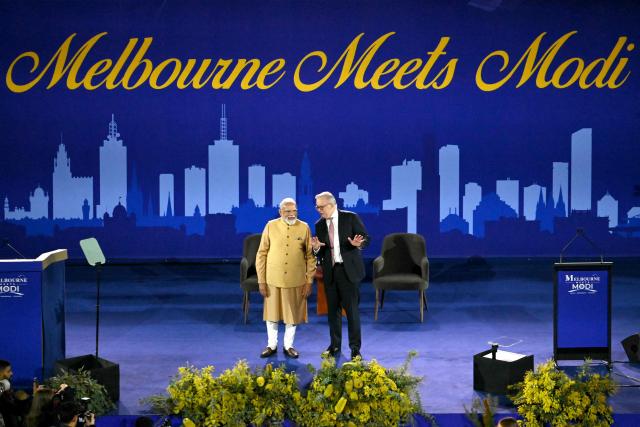Australia’s Prime Minister Anthony Albanese (R) and Indian Prime Minister Narendra Modi speak on stage during a community event at Docklands Stadium in Melbourne on July 9, 2026. (Photo by WILLIAM WEST / AFP)