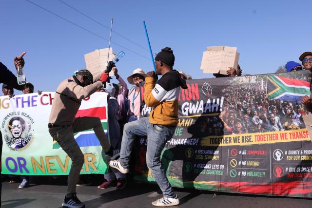 Protesters gather during an anti immigrant march to the Diepkloof police station in Soweto, on July 9, 2026. (Photo by Mzingenkosi Sibanda / AFP)