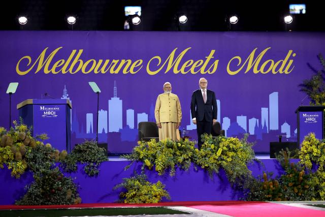 Australia’s Prime Minister Anthony Albanese (R) and Indian Prime Minister Narendra Modi stand on stage during a community event at Docklands Stadium in Melbourne on July 9, 2026. (Photo by MARTIN KEEP / AFP)