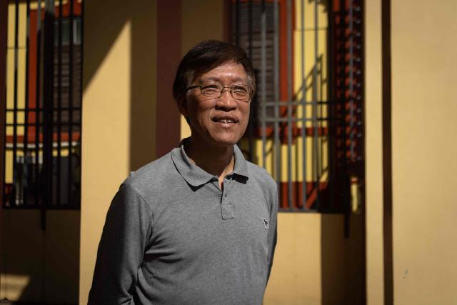 (FILES) This photo taken on December 12, 2024 shows Au Kam San, a primary school teacher who became one of Macau's longest-serving pro-democracy legislators, posing for a portrait in Macau. A Macau court said July 9, 2026 it had completed a preliminary hearing in the city's first national security case and determined a former pro-democracy lawmaker was a "principal offender" of subversion and other crimes, and would proceed to trial. (Photo by Eduardo Leal / AFP)