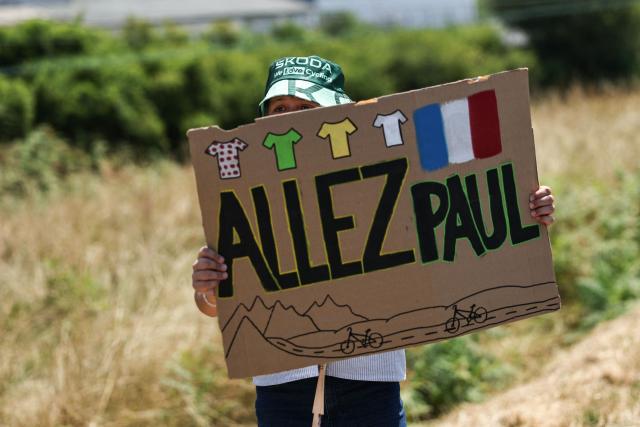 A spectator holds a placard to encourage Decathlon CMA CGM Team's French rider Paul Seixas along the race route during the 6th stage of the 113th edition of the Tour de France cycling race, 186,2 km between Pau and Gavarnie-Gèdre in the French Pyrenees, on July 9, 2026. (Photo by Anne-Christine POUJOULAT / AFP)