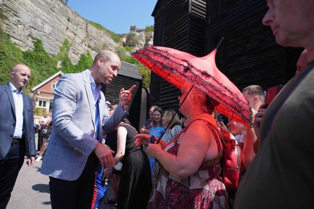 Britain's Prince William, Prince of Wales (L) meets well-wishers during his visit to Hastings, south-east England on July 9, 2026, to highlight the town's fishing community and the vital work of local youth-led and community-driven organisations. (Photo by Gareth Fuller / POOL / AFP)
