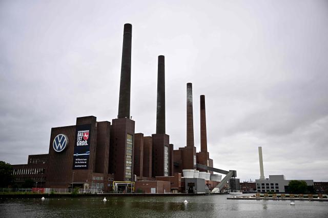 A general view taken on July 9, 2026 shows a part of the Wolfsburg Volkswagen (VW) Plant in Wolfsburg, Germany, prior to a rally of VW employees called by German trade union IG Metall to protest against restructuring and mass job cut plans at the VW headquarters in Wolfsburg, Germany. IG Metall is organising protests by VW workers outside plants across the country on July 9, when the carmaker's bosses will present the restructuring plans to the supervisory board. Europe's largest carmaker has come under intense pressure from US tariffs, slimmer profit margins from electric cars and above all intense competition in China, the world's largest auto market. VW, whose 10 brands range from mass-market Seats to premium Porsches, is already in the process of axing 50,000 jobs in Germany by 2030, including 35,000 at its namesake marque. (Photo by Tobias SCHWARZ / AFP)