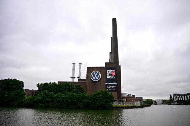 A general view taken on July 9, 2026 shows a part of the Wolfsburg Volkswagen (VW) Plant in Wolfsburg, Germany, prior to a rally of VW employees called by German trade union IG Metall to protest against restructuring and mass job cut plans at the VW headquarters in Wolfsburg, Germany. IG Metall is organising protests by VW workers outside plants across the country on July 9, when the carmaker's bosses will present the restructuring plans to the supervisory board. Europe's largest carmaker has come under intense pressure from US tariffs, slimmer profit margins from electric cars and above all intense competition in China, the world's largest auto market. VW, whose 10 brands range from mass-market Seats to premium Porsches, is already in the process of axing 50,000 jobs in Germany by 2030, including 35,000 at its namesake marque. (Photo by Tobias SCHWARZ / AFP)