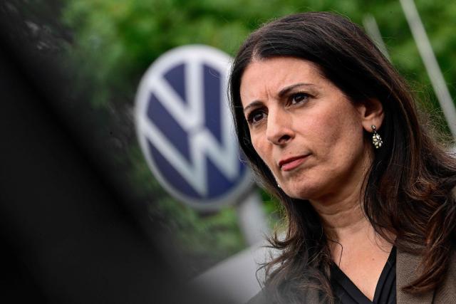 Daniela Cavallo, chairwoman of the central works council of German car maker Volkswagen (VW) attends a rally to protest against restructuring and mass job cut plans at the VW headquarters on July 9, 2026 at the Wolfsburg Volkswagen Plant in Wolfsburg, northern Germany. IG Metall is organising protests by VW workers outside plants across the country on July 9, when the carmaker's bosses will present the restructuring plans to the supervisory board. Europe's largest carmaker has come under intense pressure from US tariffs, slimmer profit margins from electric cars and above all intense competition in China, the world's largest auto market. VW, whose 10 brands range from mass-market Seats to premium Porsches, is already in the process of axing 50,000 jobs in Germany by 2030, including 35,000 at its namesake marque. (Photo by Tobias SCHWARZ / AFP)